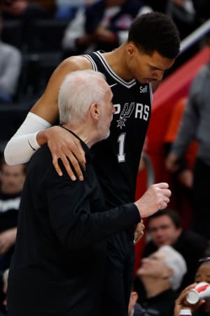 Jan 10, 2024; Detroit, Michigan, USA; San Antonio Spurs head coach Gregg Popovich talks to center Victor Wembanyama (1) in the second half against the Detroit Pistons at Little Caesars Arena.
